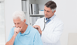 Doctor talking to a Middle-aged person coughing or appearing short of breath