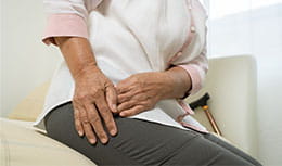 Hip pain of Senior woman at home