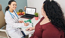 Physician talking with female patient
