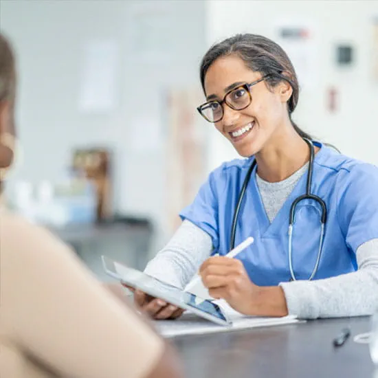 Nurse with patient using a tablet