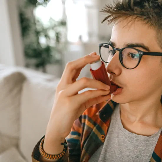 Boy with asthma inhaler