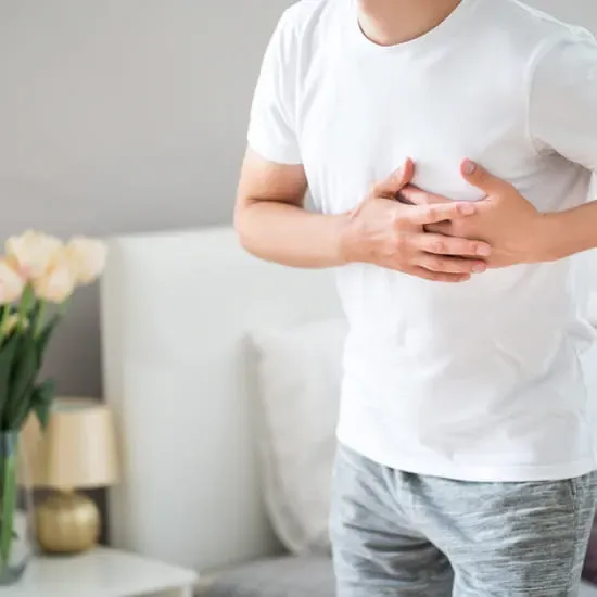 Man holding chest