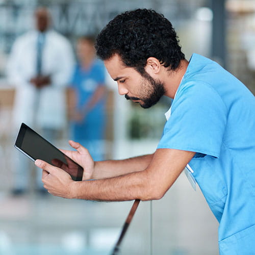 Shot of a young medical practitioner using a digital tablet in a hospital