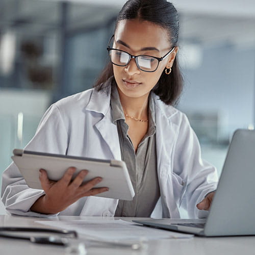 Doctor reading a tablet