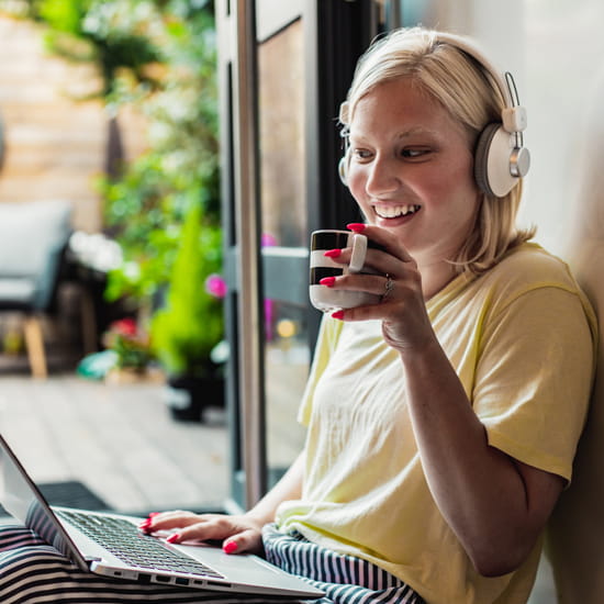 Smiling woman on laptop computer