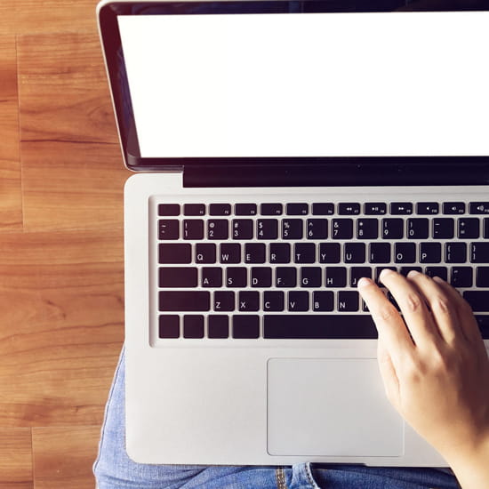Typing on laptop computer