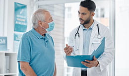 Clinician talking to elderly person