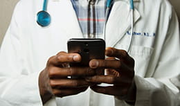 Physician holding a cellphone