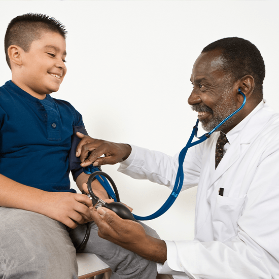 doctor giving child a blood pressure reading