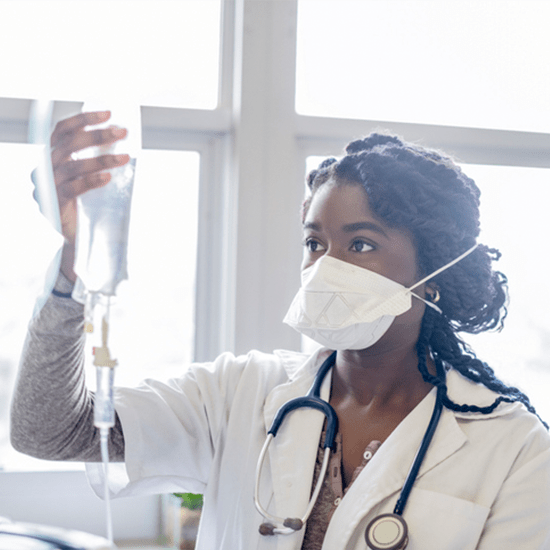 doctor checking IV bag