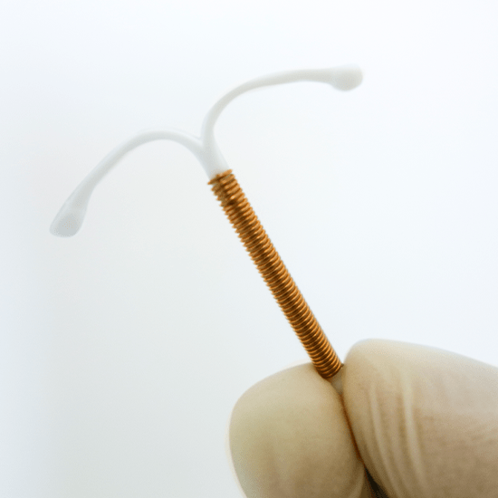 Physician holding an IUD