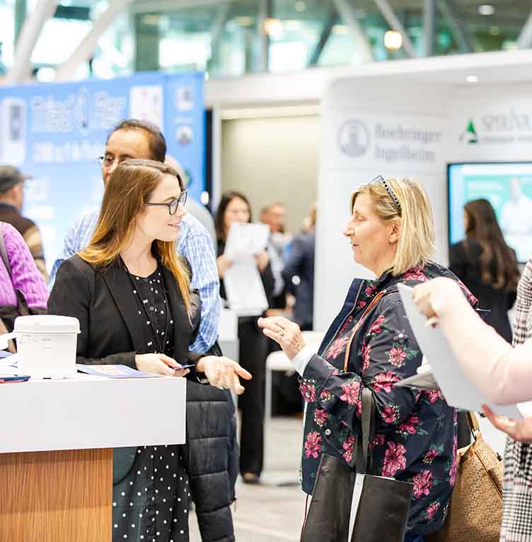 primary care clinicians networking in the exhibit hall