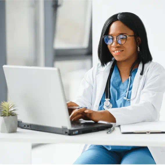 Clinician typing on a computer