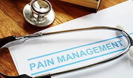 Pain management headline with stethoscope wrapping around