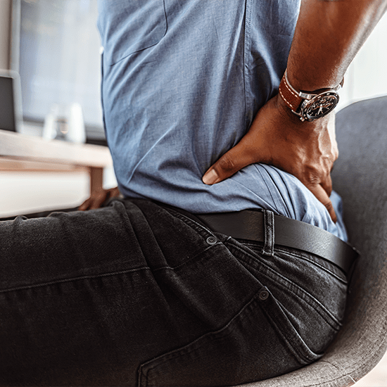 Man holding his back from back strain