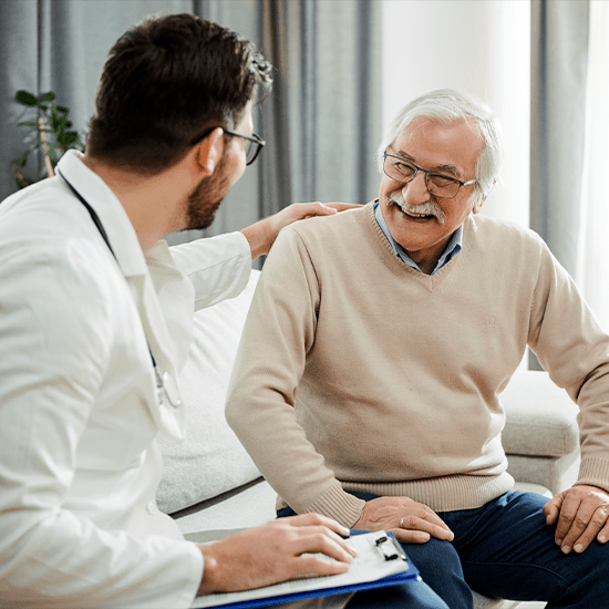 doctor laughing with elderly patient