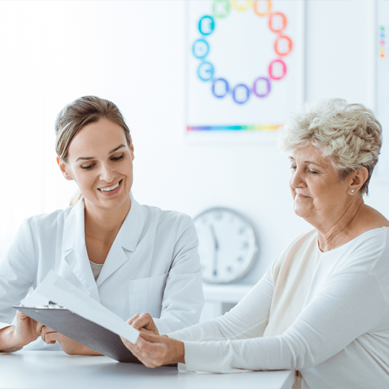 doctor reviewing a chart with patient
