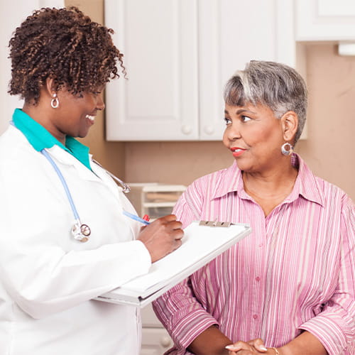 Female doctor talking to female patient