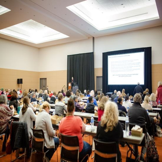 Conference attendees experiencing Industry Theater presentation