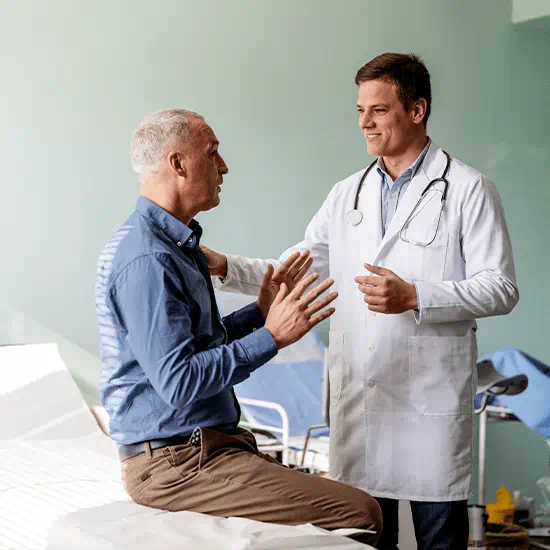 doctor with hand on patients shoulder