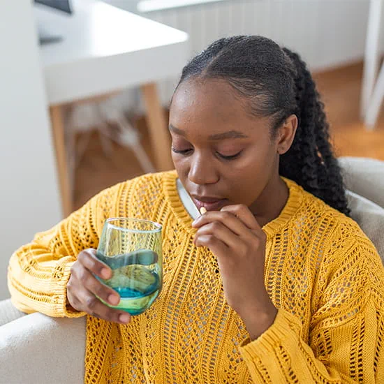 Women about to take her medication