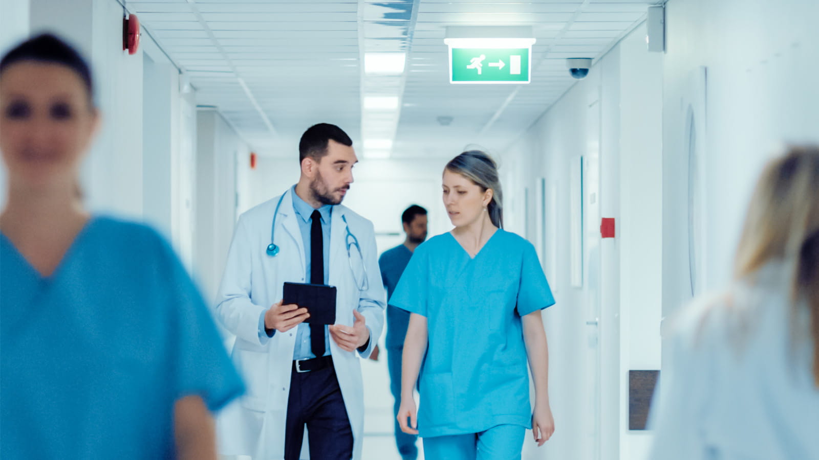 Doctors in the hallway speaking