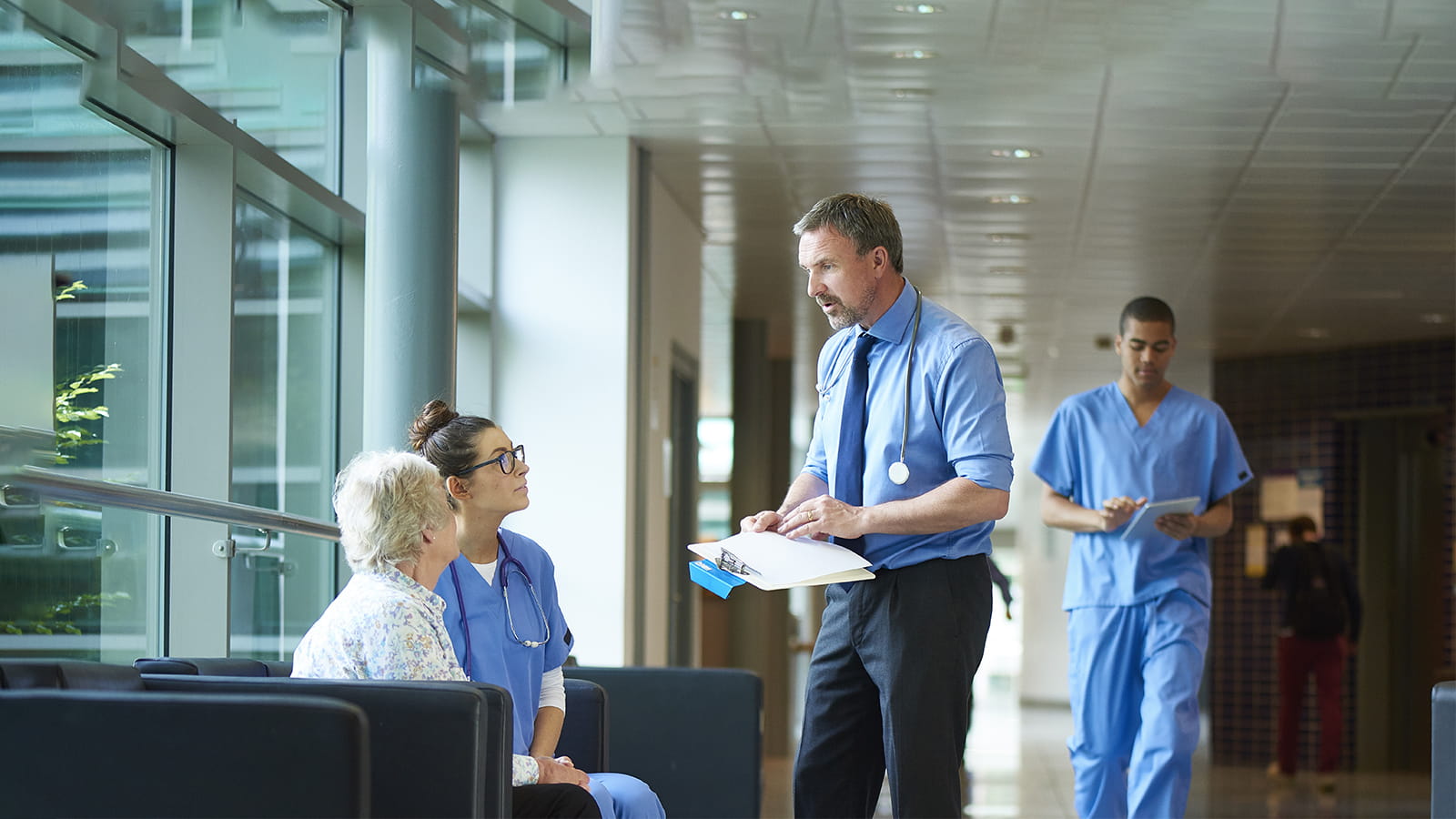 Doctor chatting to a patient on the hospital corridor