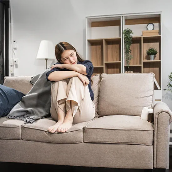 woman with depression on the couch
