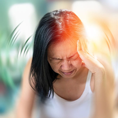 Illustration of a woman with a migraine