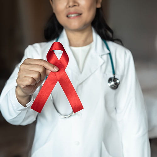 Doctor holding HIV ribbon
