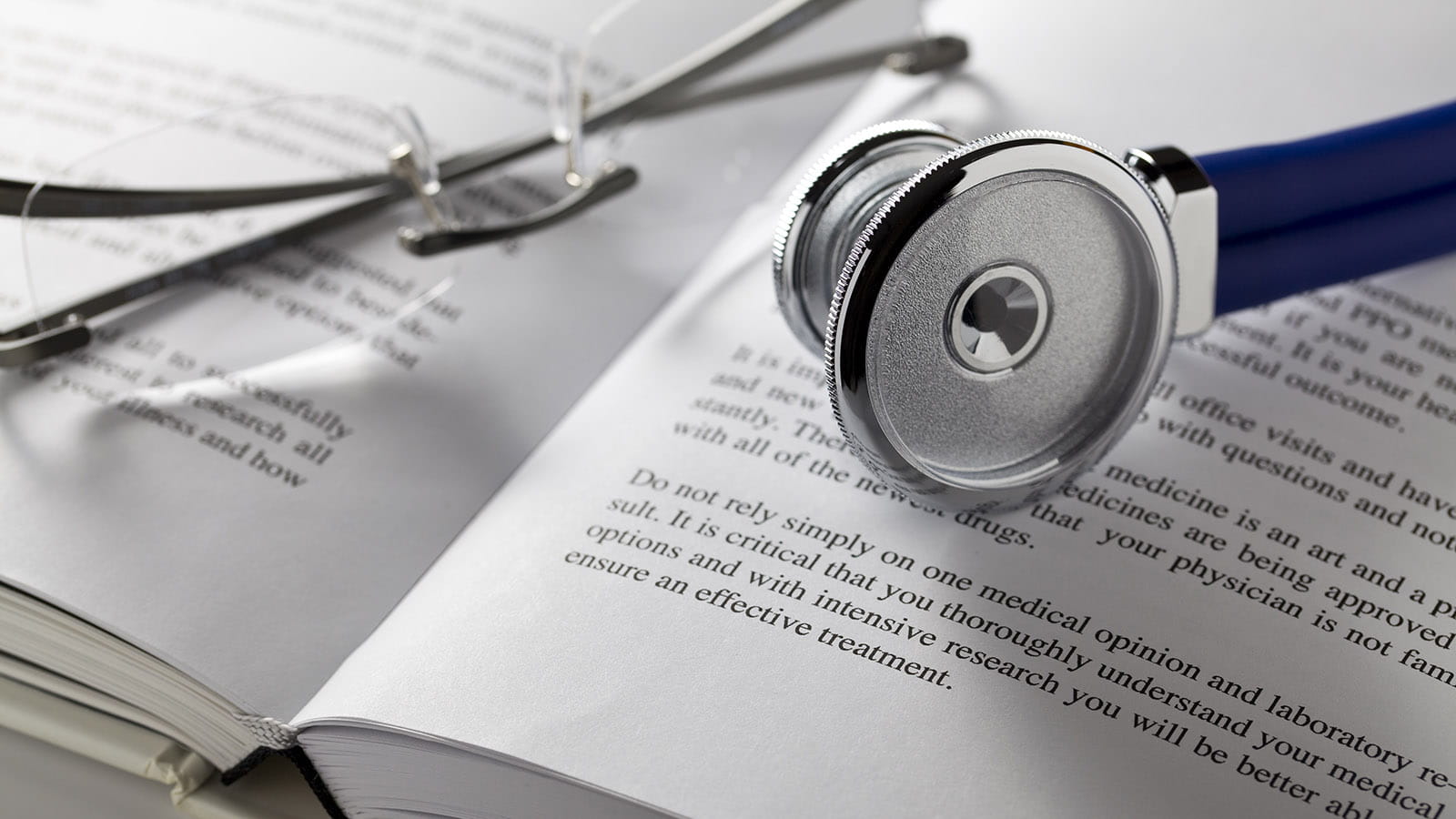 Stethoscope resting on top of a book