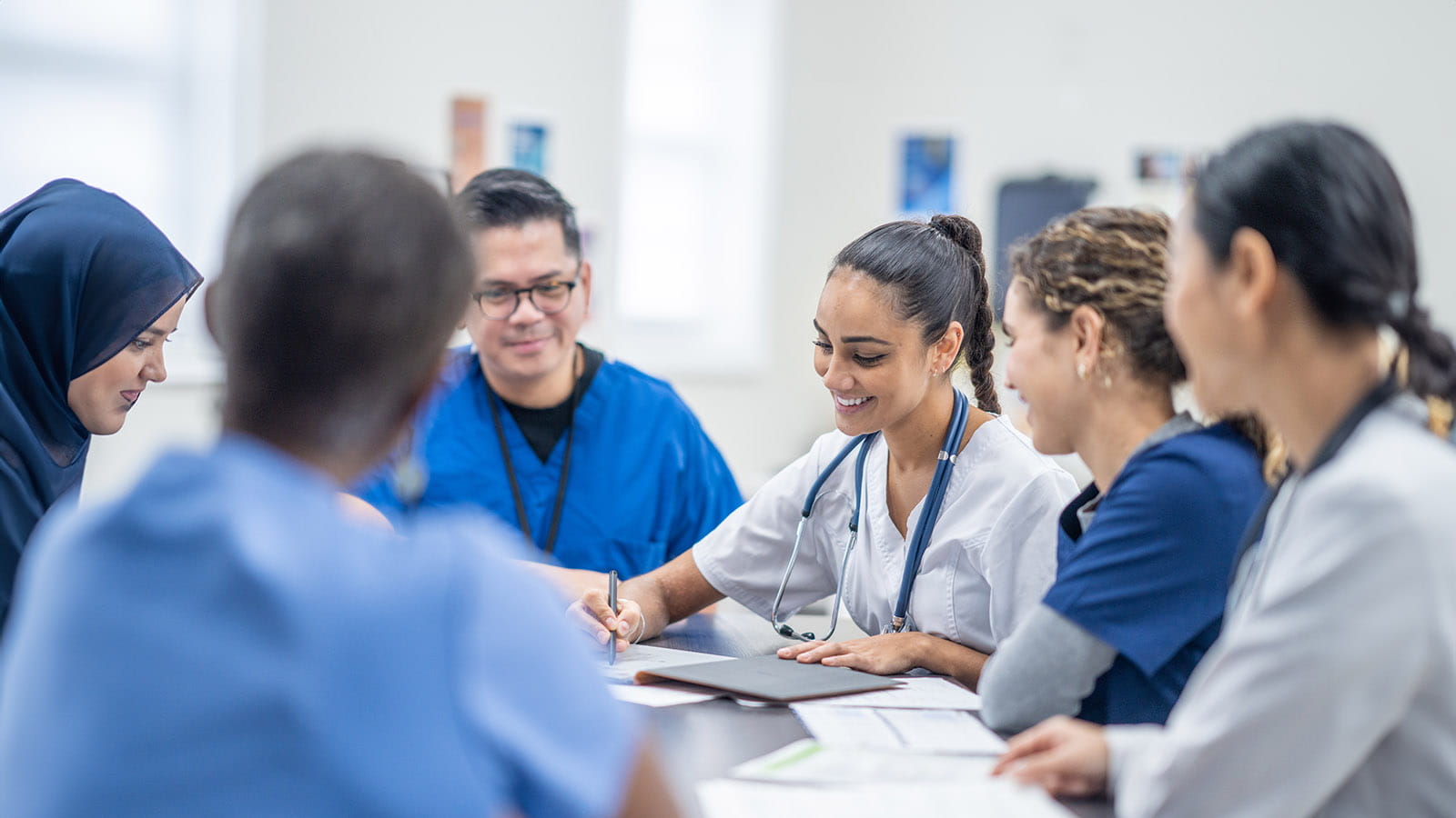 Team of medical professionals meeting around a table