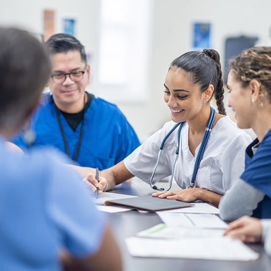 Team of medical professionals meeting around a table