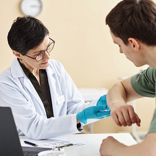Doctor examining a patient's arm