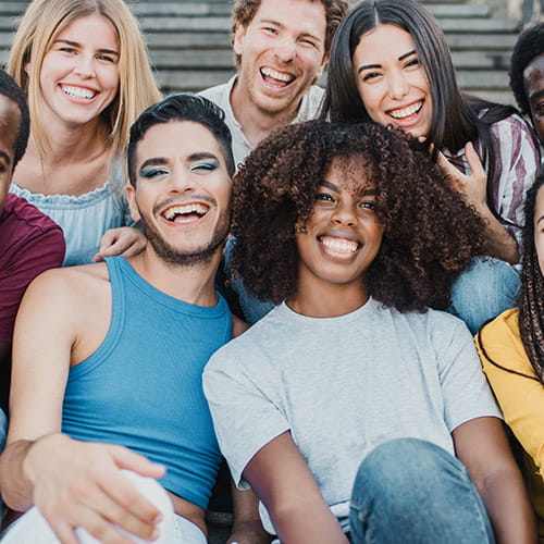 Young group of people smiling on stairs