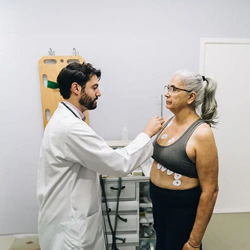 Doctor placing sensors on a patient