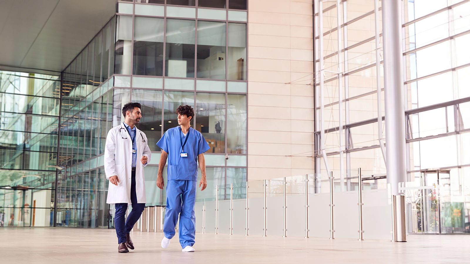 Medical workers walking outside of a hospital