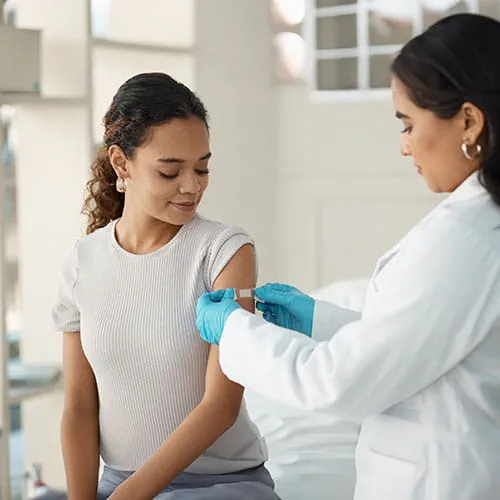 Doctor giving patient a band-aid