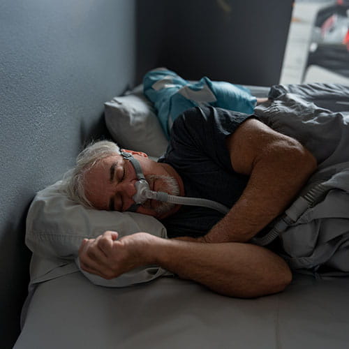 Man sleeping with sleep mask