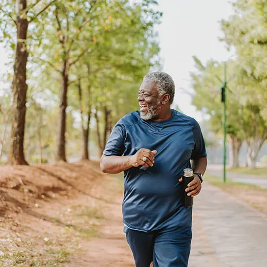 Man running in public park