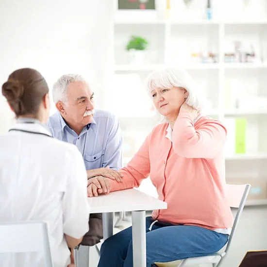 Man holding a medicine bottle in one hand and pill in other