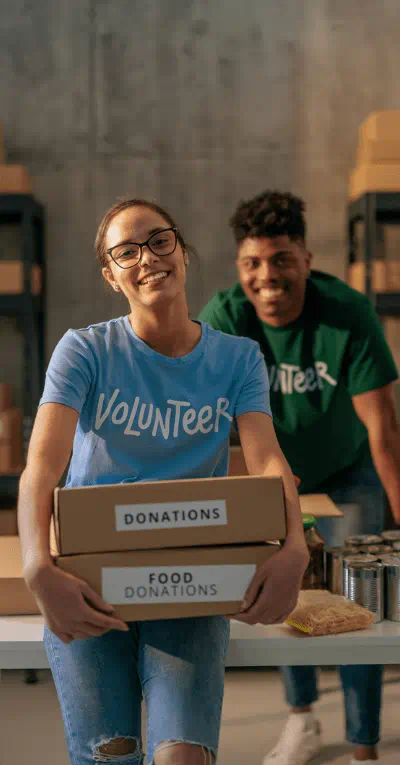 Food Bank food drive volunteers carrying boxes of food.