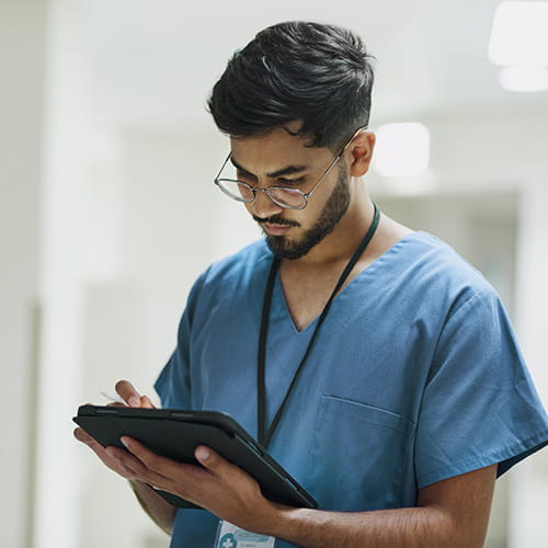 Med student reading a tablet