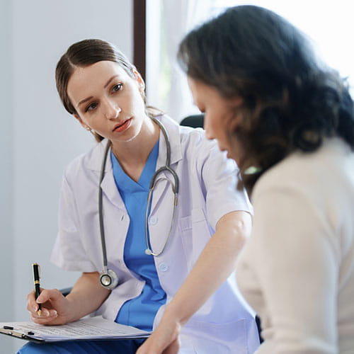 Female doctor talking to a patient