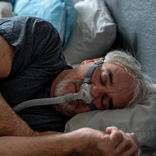 Man sleeping with a CPAP