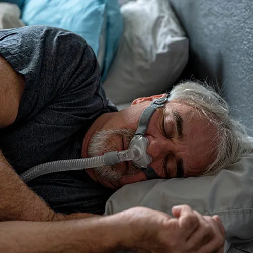 Man sleeping with a CPAP