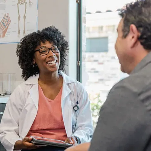 Medical professional meeting with a patient