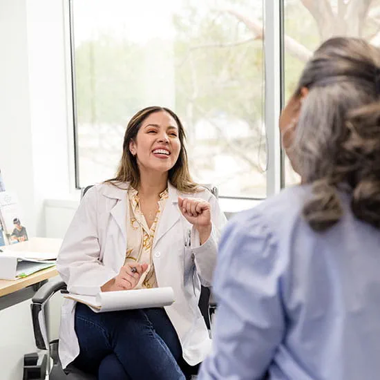 nurse practitioner talks to patient