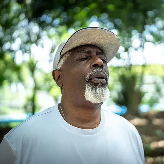 older man resting to breathe