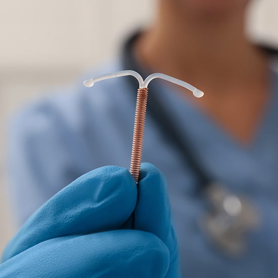 doctor holding an iud